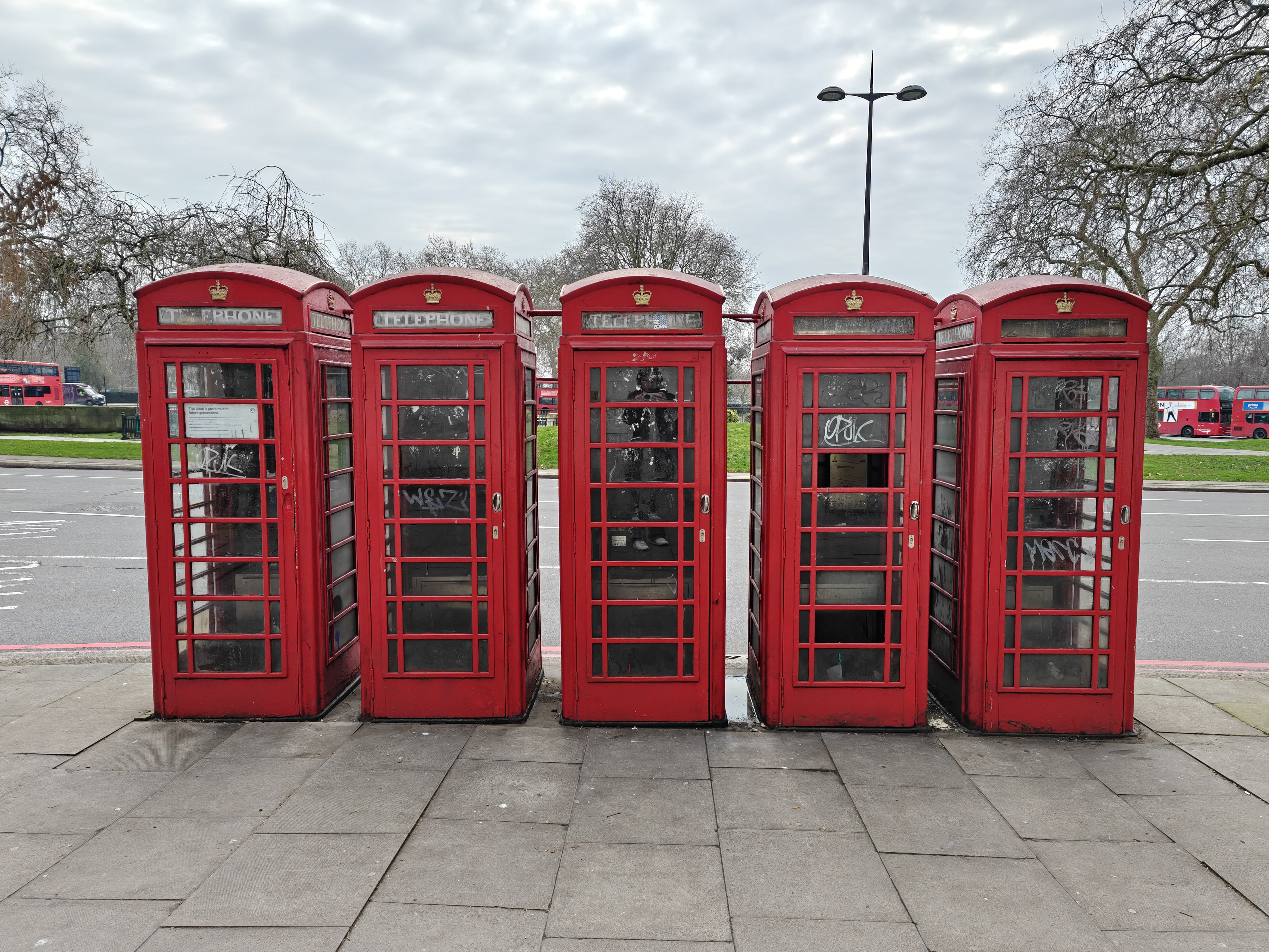 Five London phone boxes in a row