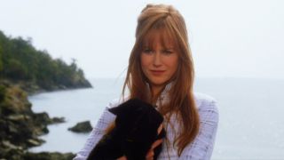 Nicole Kidman with a black cat in Practical Magic.