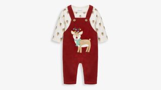 A red baby dungaree set with a reindeer motif and reindeer print bodysuit, shot on a white background