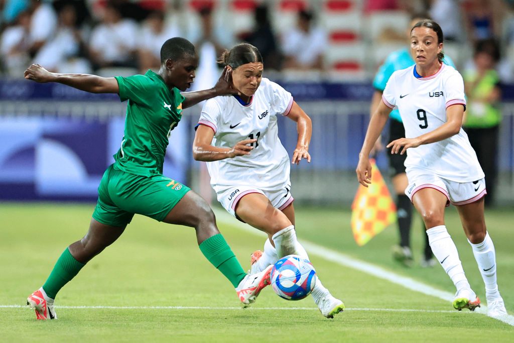 Zambia&#039;s defender #04 Esther Siamfuko (L) and US&#039; forward #11 Sophia Smith vie for the ball in the women&#039;s group A football match between the USA and Zambia during the Paris 2024 Olympic Games at the Nice Stadium in Nice, on July 25, 2024.