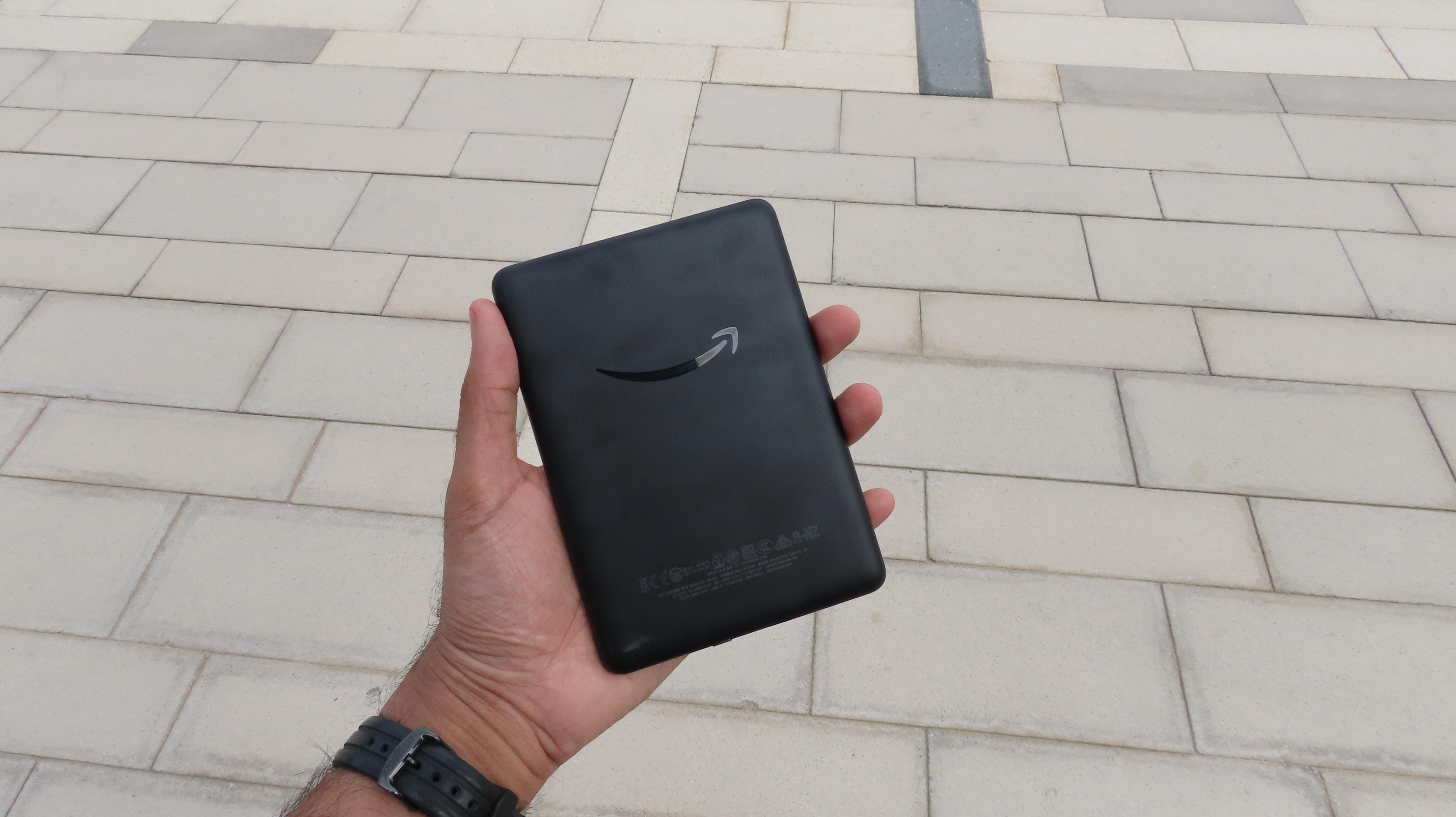 A Kindle (2019) held in someone's hand, shown from the back