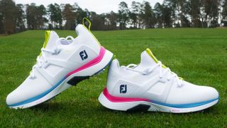FootJoy Hyperflex Carbon Golf Shoe and its excellent pink and blue colorway resting on the golf course