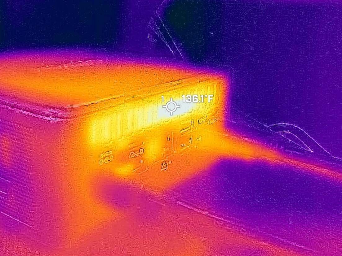 Pictures taken with a thermal camera of the Geekom IT13's vents, with a reading of 136 degrees F.