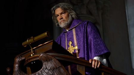 The priest at the lectern. 