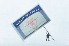 Man lifting a Social Security card