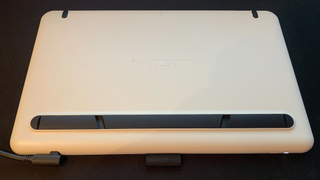 The underside of the Wacom One with its retractable legs folded away,