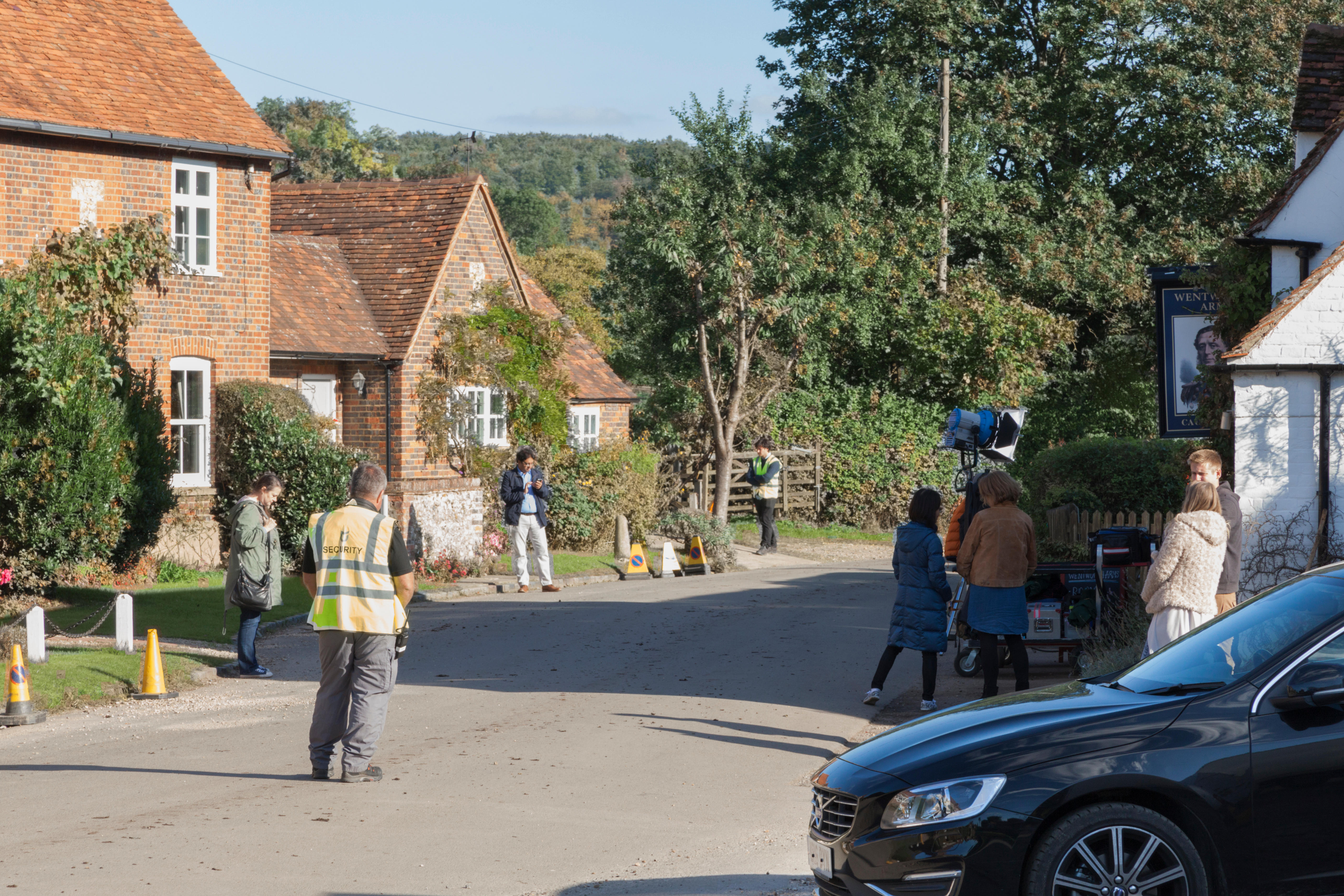 Cast and crew are waiting between scenes on-location filming for the 2017 series of Midsomer Murders, Turville, Buckinghamshire, England.