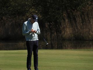 Neil Tappin making notes on the golf course