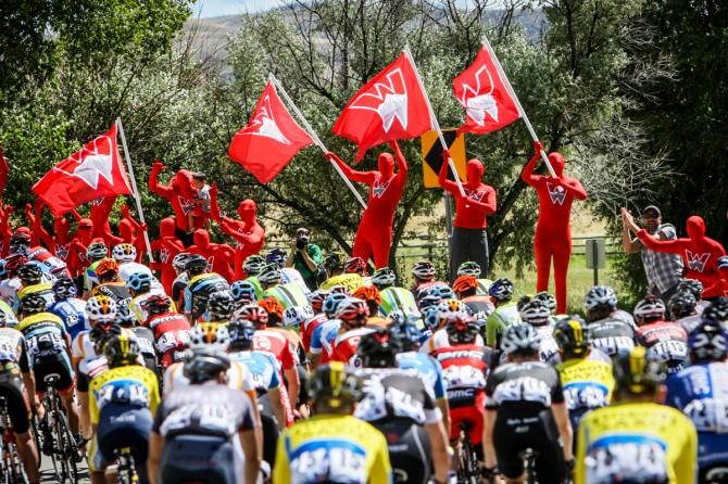 The red man group from Western State College in Gunnison cheers the peloton