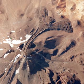 astronaut photograph of Llullaillaco volcano, which is situated on the Argentina/Chile border