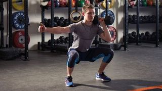 One-arm dumbbell thruster