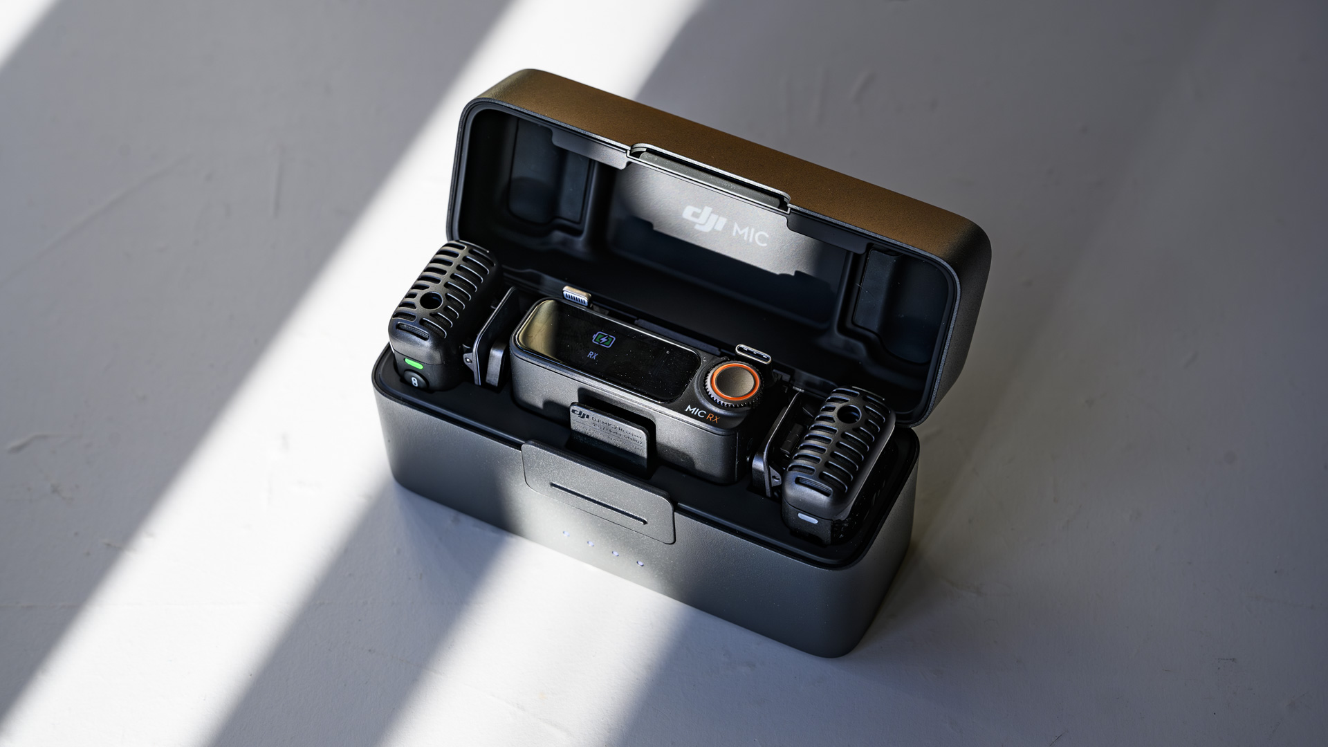 DJI Mic 2 charging case open with contents inside