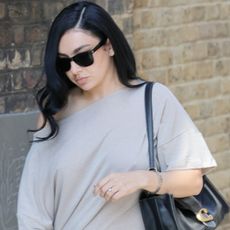 Charli xcx styled an indie-sleaze shirt dress with platform pumps and an oversized Coach Tabby Bag