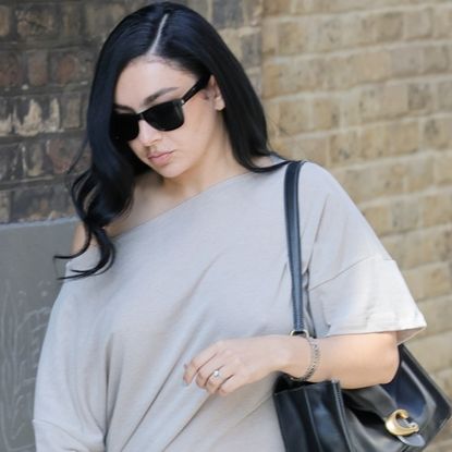Charli xcx styled an indie-sleaze shirt dress with platform pumps and an oversized Coach Tabby Bag