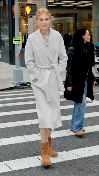 Nicole Kidman wearing a wool coat with brown Uggs
