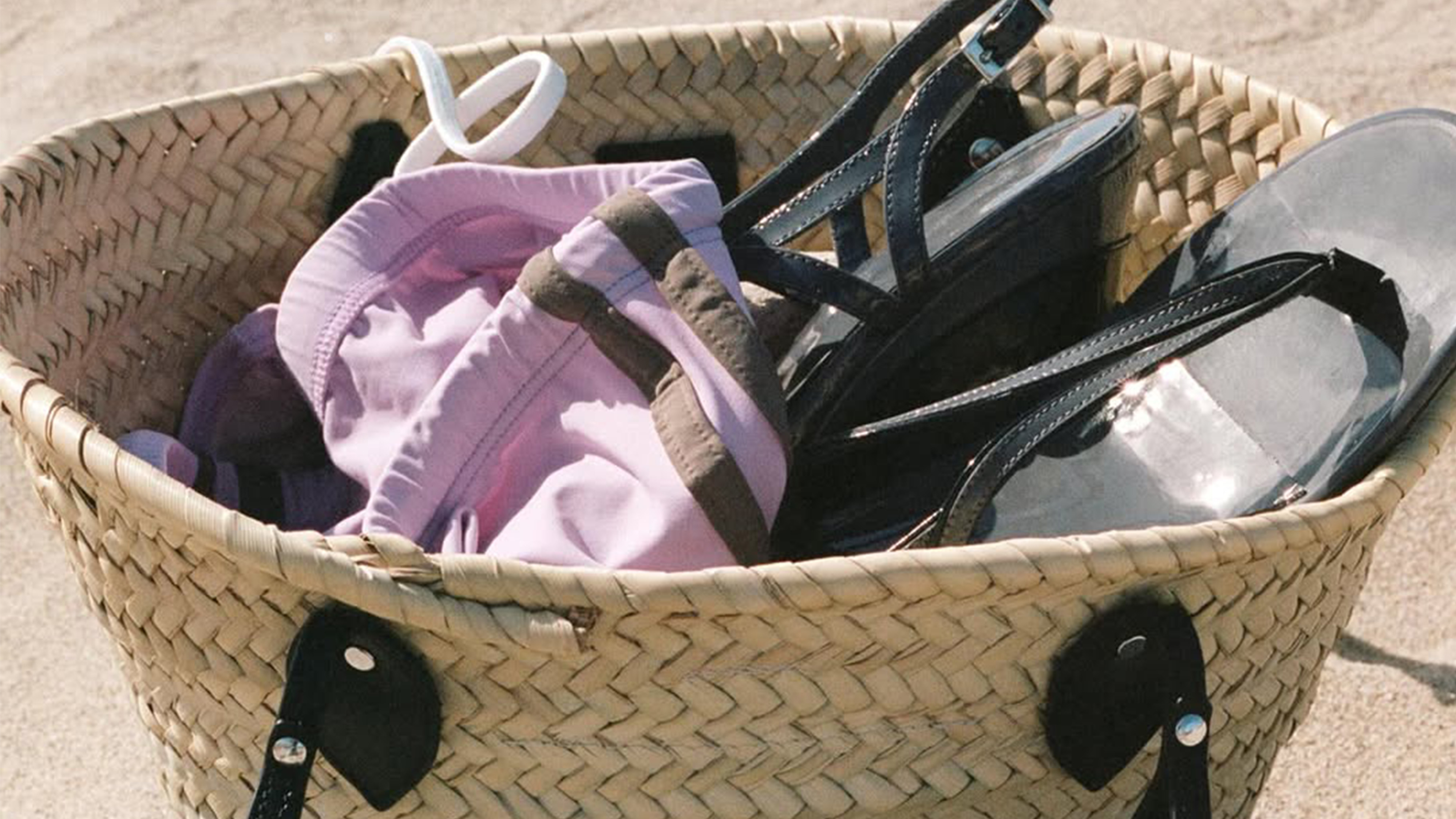 Gimaguas bag filled with swimwear and shoes. 