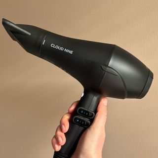 Laura holding Cloud Nine The Airshot Hair Dryer - best hair dryers