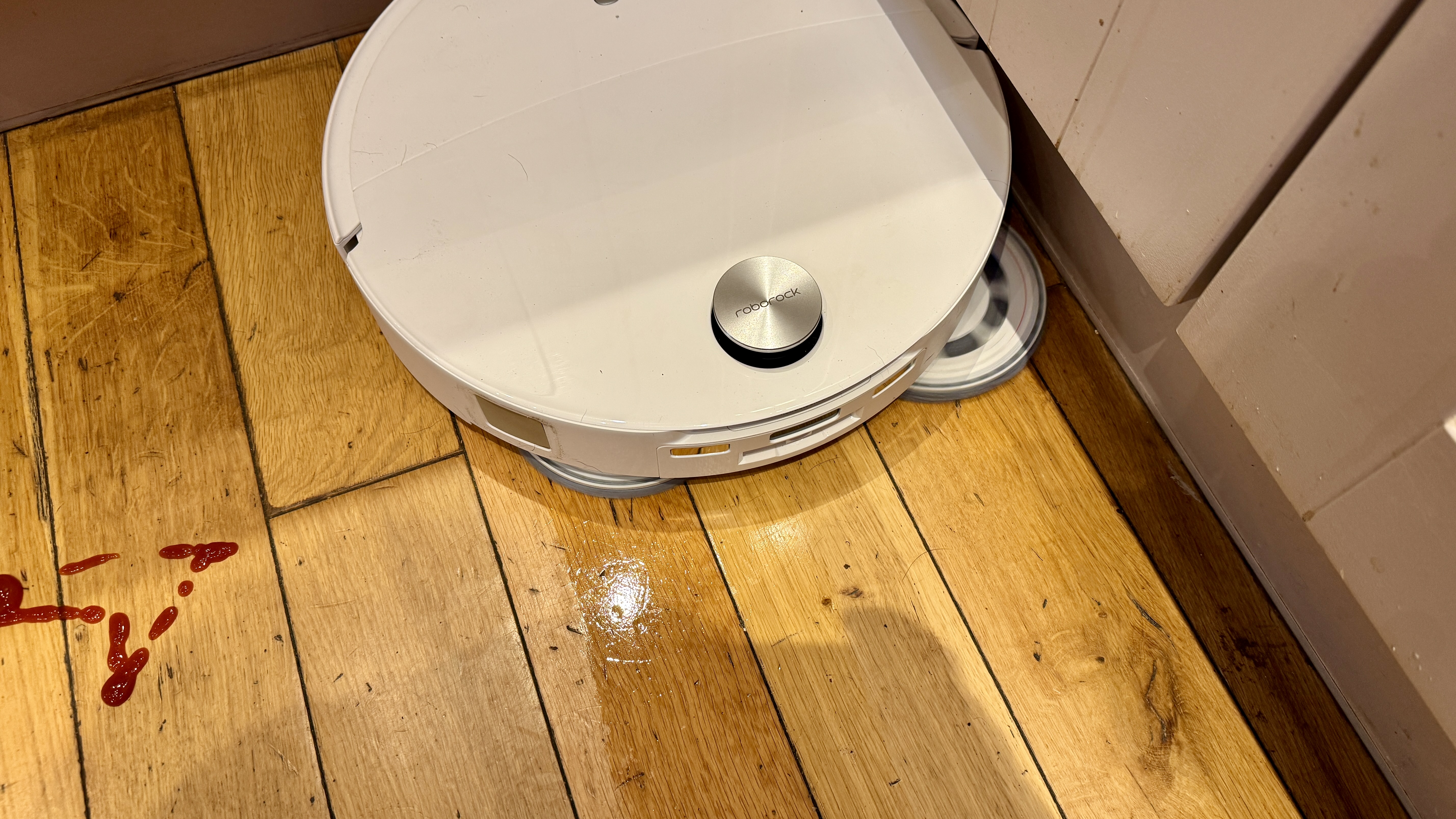 Roborock Qrevo Curv 2 Pro cleaning a spillage from a hard floor