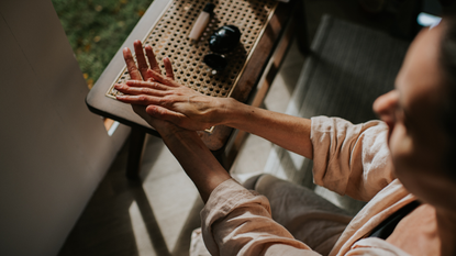 How to use lube: A woman rubbing lube into her hands