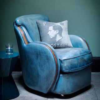 blue leather chair with cushion