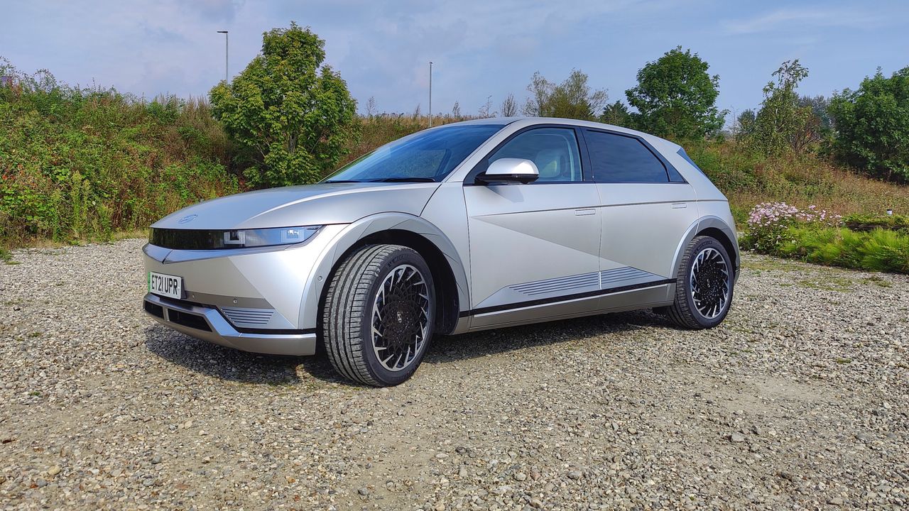 Side-on, at an angle, view of Ioniq in gravel parking lot