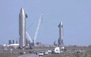 SpaceX's Starship SN10 prototype (left) rolls out to its test stand while SN9 stands on its own pad at the company's South Texas facility near Boca Chica Village on Jan. 29, 2021. SN10 performed its second static-fire test on Feb. 25, 2021.