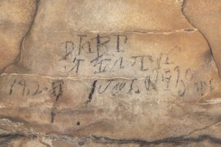 A section of the Cherokee syllabary, which was found about almost 1 mile (1.5 kilometers) inside Manitou Cave in Alabama.