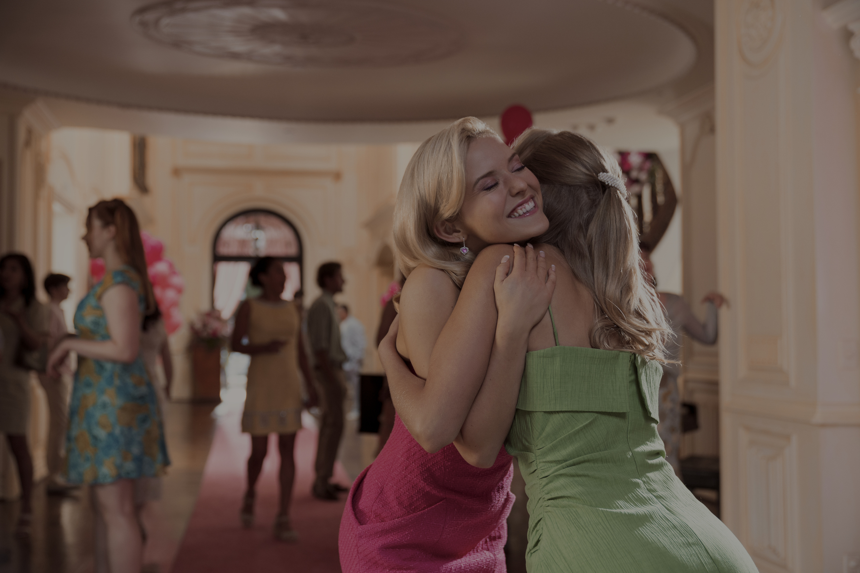 Elle Woods giving her friend a hug in a custom pink dress