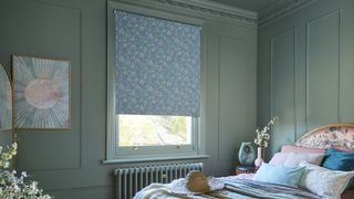 bedroom with walls, ceiling and woodwork painted in the same shade of soft teal