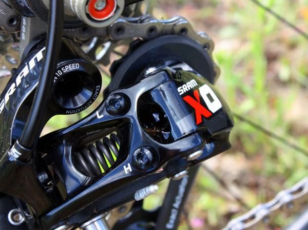 Gone on the new X.0 rear derailleur are the dual pin clips, which were sometimes susceptible to crash damage. Pins are now only used on the more protected upper ends while the other side is solid aluminum.
