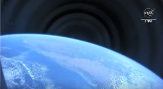 A view of the Earth from space through the window of SpaceX's Crew Dragon Endurance as seen by the Crew-3 astronauts on Nov. 11, 2021.