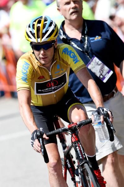 Chris Horner (RadioShack) heads back to the podium to get the leader's jersey for another day.