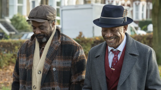 Morris (Ariyon Bakare) and Barrington (Lennie James), dressed in coats and hats, walk together in Mr Loverman 