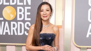 Michelle Yeoh is pictured with a sleek, side-swept hairstyle whilst attending the 80th Annual Golden Globe Awards at The Beverly Hilton on January 10, 2023 in Beverly Hills, California.