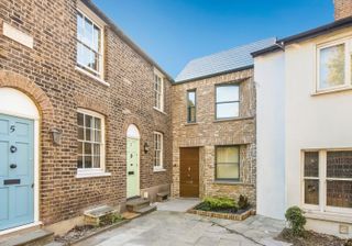 brick clad self build with angled windows