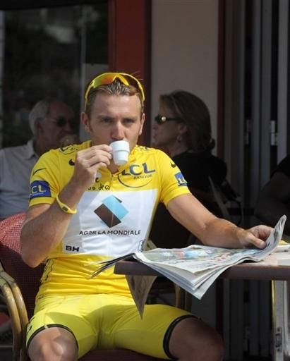 Rinaldo Nocentini (AG2R La Mondiale) enjoys a coffee while wearing the Tour de France race leader's jersey.