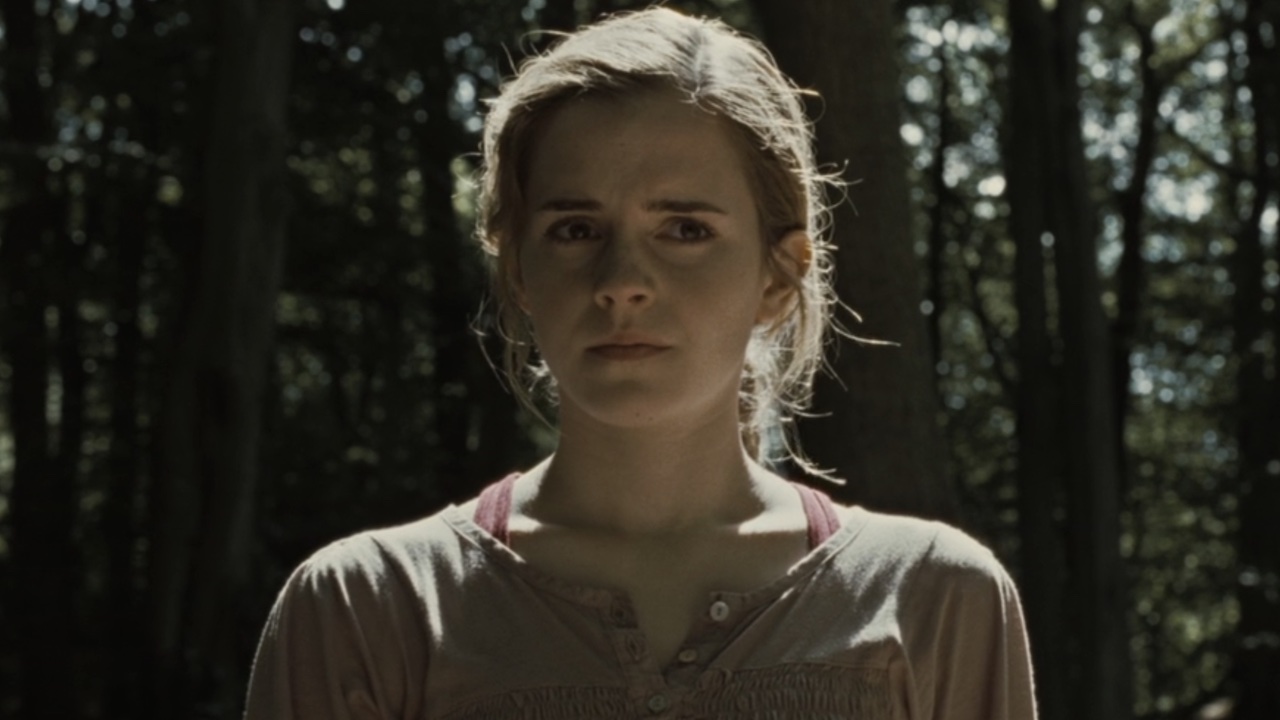 Hermione looking concerned in the woods in Harry Potter 7.