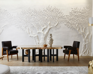 Embossed tree on white dining room wall with contemporary dining room table and sculptural vases