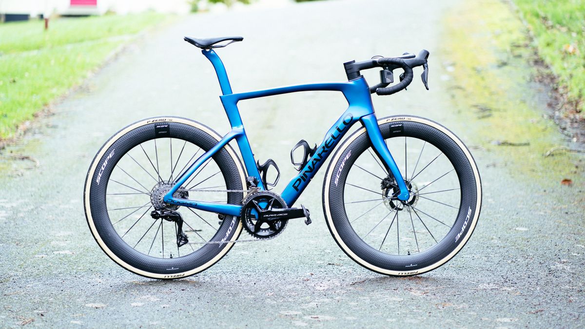 A blue Pinarello Dogma with Scope Artech 6A wheels fitted