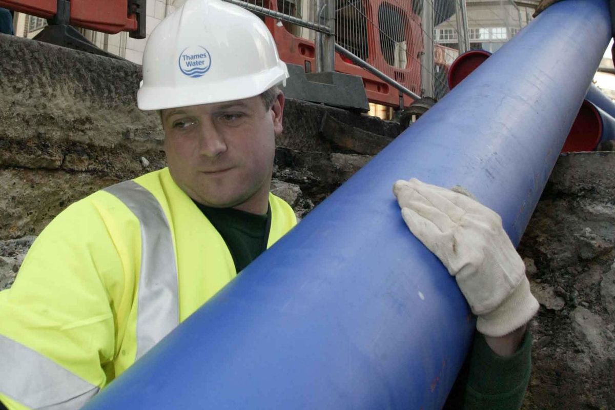 Man carrying a larger pipe