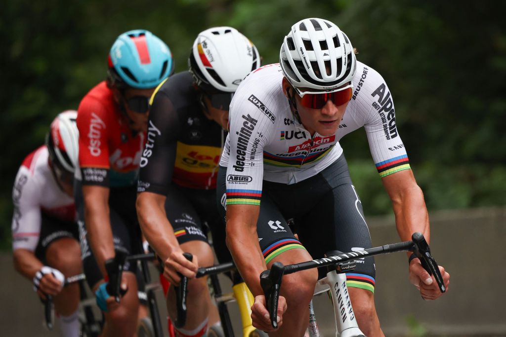 Alpecin-Deceuninck team's Belgian rider Mathieu Van Der Poel (R), cycles ahead of Lotto Dstny team's Belgian rider Arnaud De Lie (2nd R), Lotto Dstny team's Belgian rider Cedric Beullens (2nd L) and Cofidis team's French rider Bryan Coquard (L) in a breakaway during the 14th stage of the 111th edition of the Tour de France cycling race, 151,9 km between Pau and Saint-Lary-Soulan Pla d'Adet, in the Pyrenees mountains in southwestern France, on July 13, 2024. (Photo by Anne-Christine POUJOULAT / AFP)
