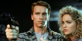 Arnold Schwarzenegger on the left, Sharon Stone on the right total recall