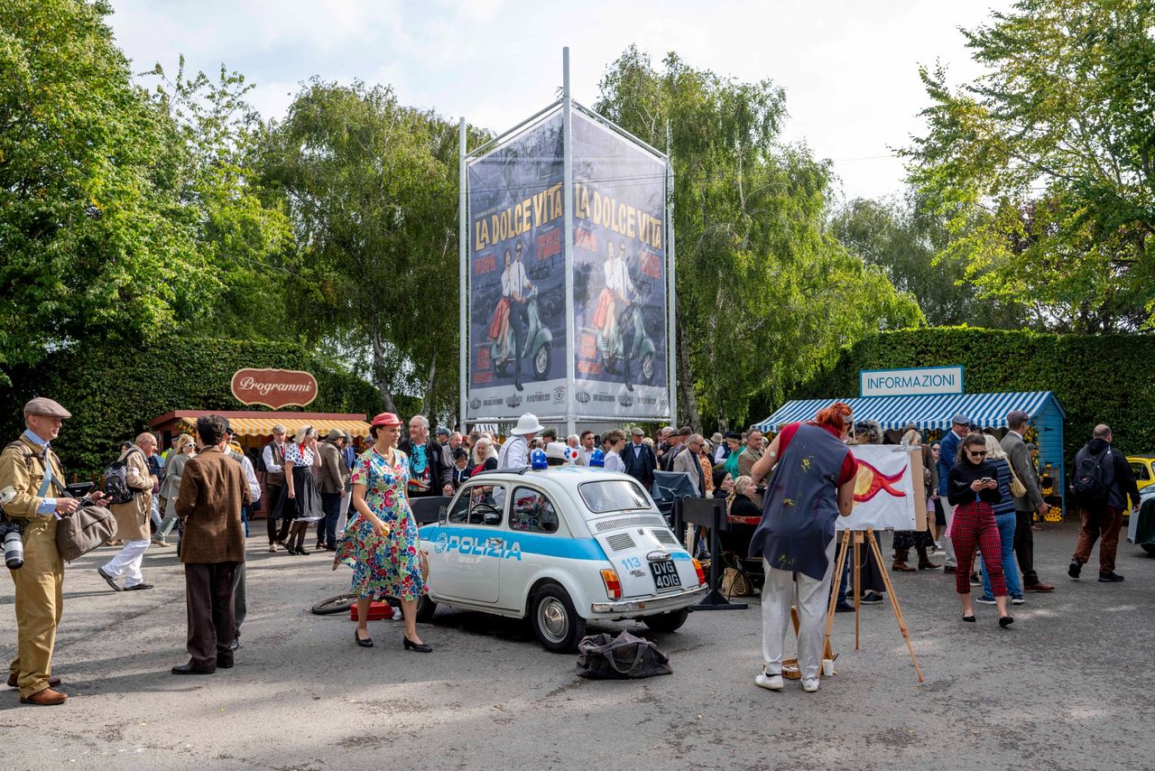 Images from the Revival. Fast cars, people in vintage dress, everyone having a nice time.