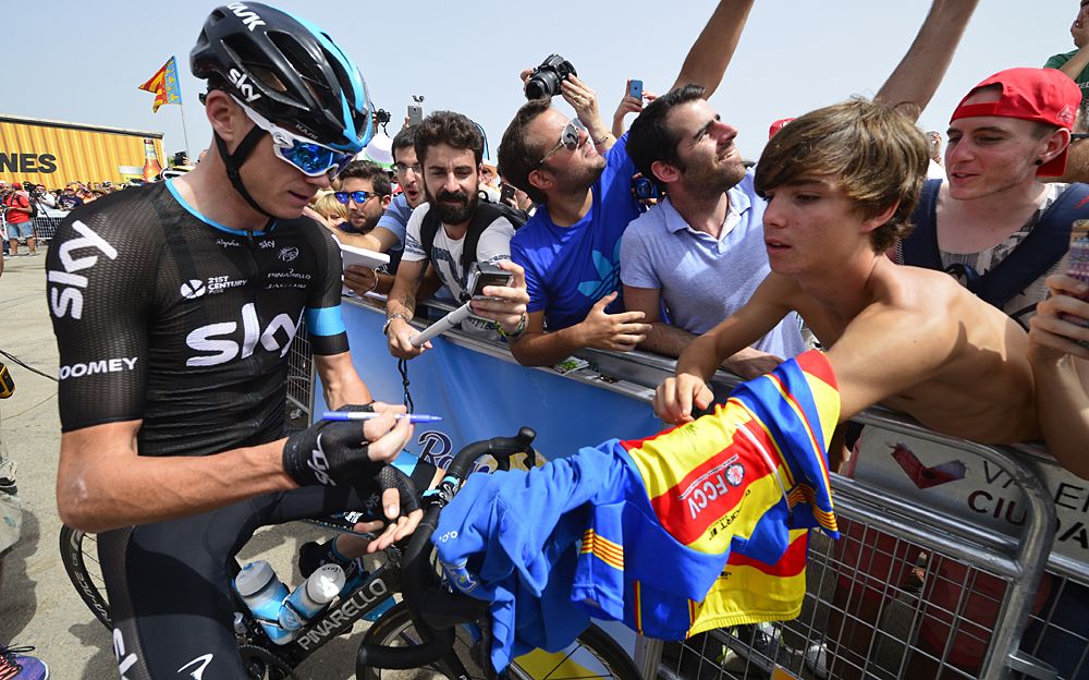 Team Sky's Chris Froome meets with fans at the start of stage 10