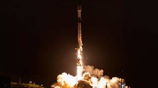 A SpaceX Falcon 9 rocket rests on the deck of a drone ship shortly after launching launching 27 Starlink satellites from Vandenberg Space Force Base on Dec. 2, 2025.