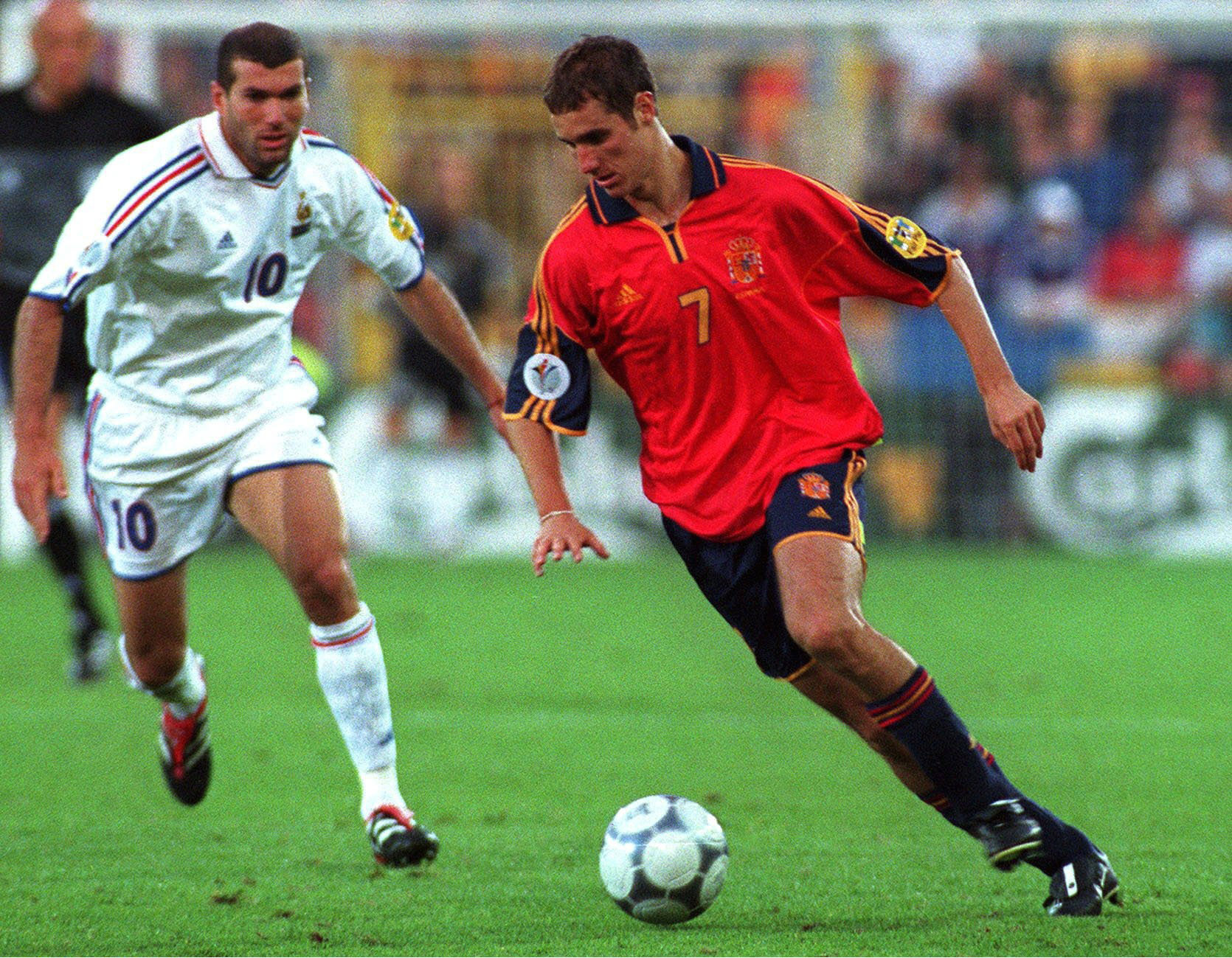 Spain's Ivan Helguera on the ball and under pressure from France's Zinedine Zidane at Euro 2000.