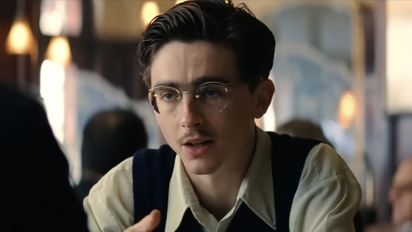Timothee Chalamet in glasses and small mustache in his power house performance in Marty Supreme (2025). 