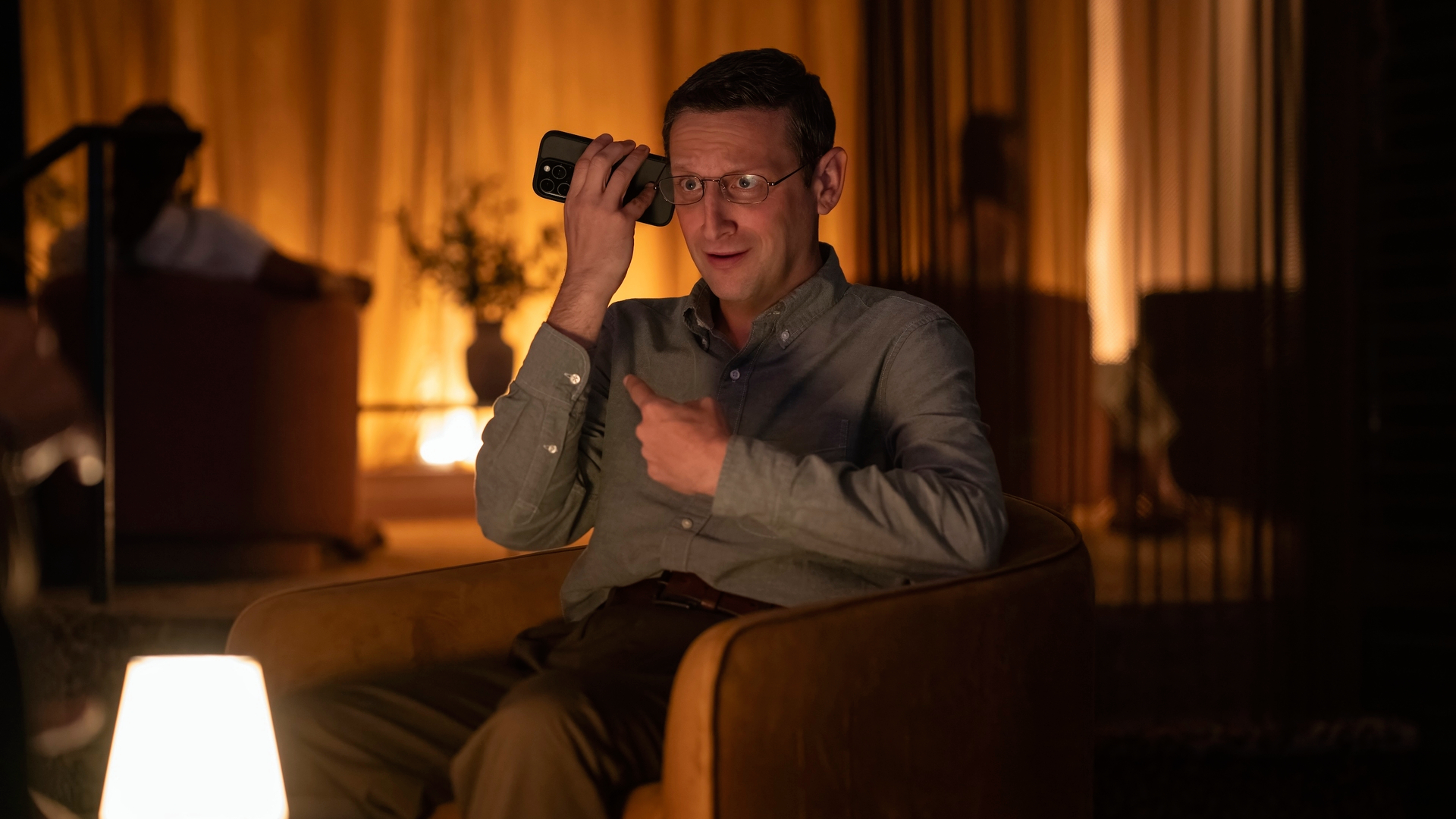 Ron Trosper (Tim Robinson) holds his phone up to his ear in a scene from &quot;The Chair Company&quot;