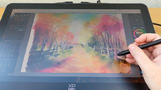 XPPen Artist Pro 19 (Gen 2) review; photos of a drawing tablet being used