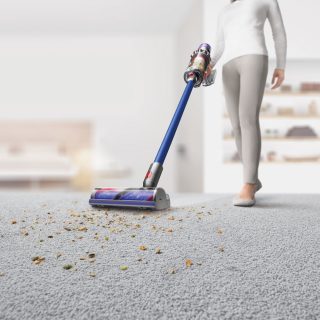 Vaccum cleaner and women with blur background